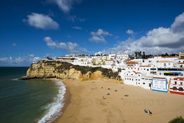 Bay with beach and colourful houses