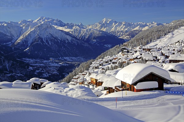 View of the village overlooking the Rhone valley with deep snowfall