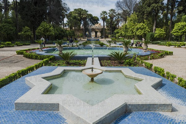 City park with fountain and flowers