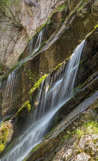 Waterfall on mossy slope