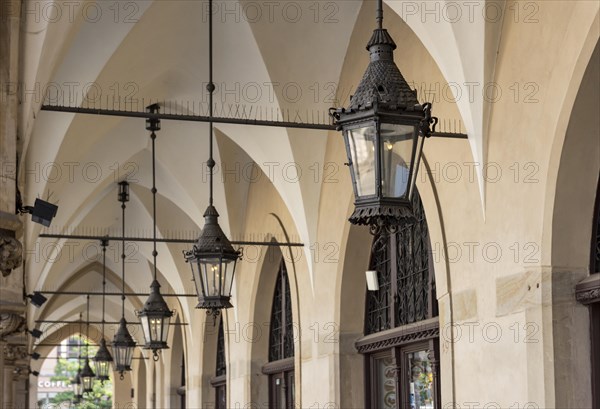 Lamps at arcades of Cloth Hall