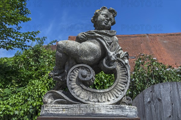 Baroque putto figure on a pedestal