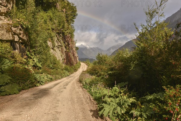 Gravel road with rainbow at Puerto Rio Tranquilo