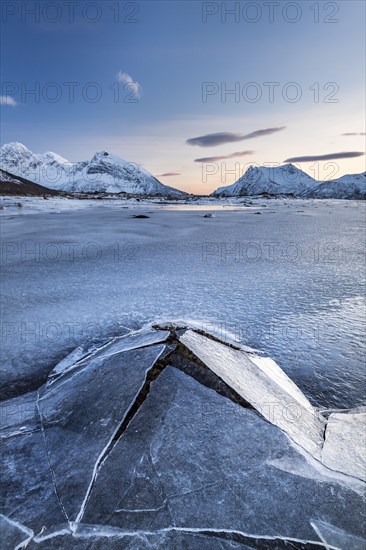 Frozen fjord with broken ice