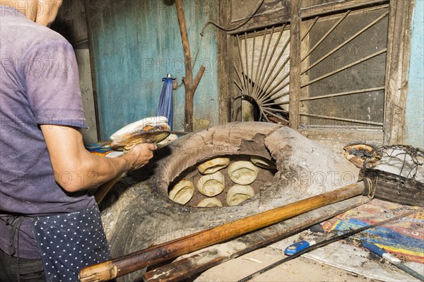 Kyrgyz man preparing the traditional Kyrgyz bread