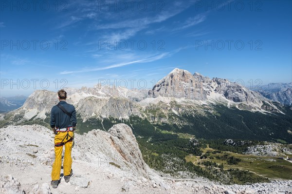 Hiker on the summit of the Averau