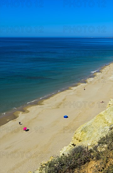 Long empty sandy beach in the Algarve