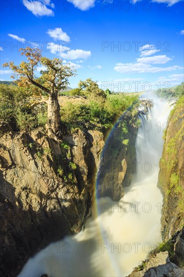 Rainbow over waterfall