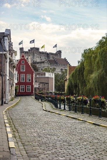 Road along the River Leie with a view of Gravensteen Castle