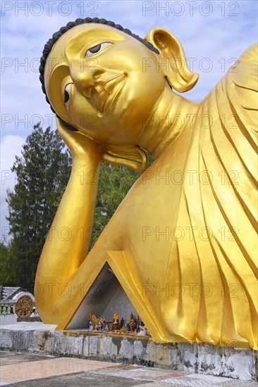 Lying golden Buddha in the temple Wat Sri Sunthon