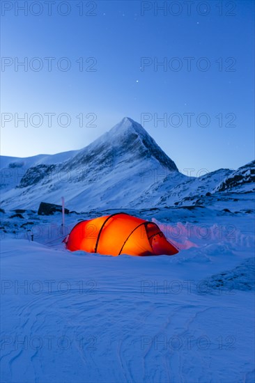 Tent with person in the snow