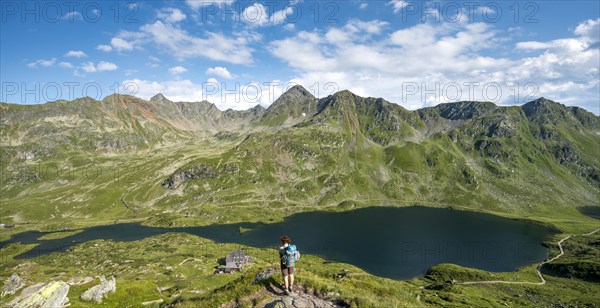 Hiker on the way to the mountain hut Ignaz-Mattis-Hutte