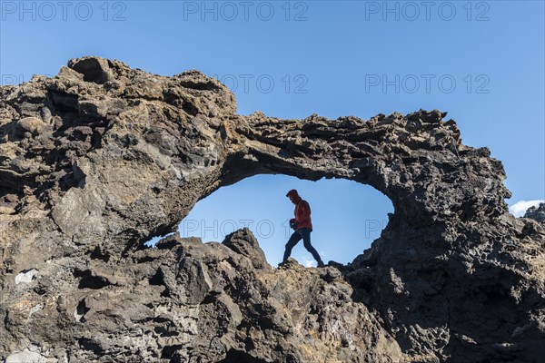 Man in a rock arch