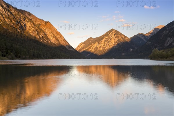 Mountains at lake Heiterwanger See in the evening light