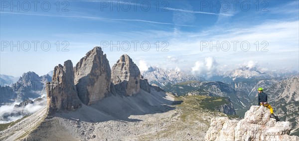 Hiker at the summit of the Paternkofel