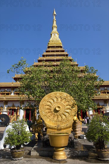 Wheel of Life in front of a nine-story Stupa Phra Mahathat Kaen Kakhon