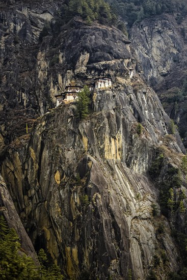 Buddhist tiger nest monastery Taktshang on steep rock face