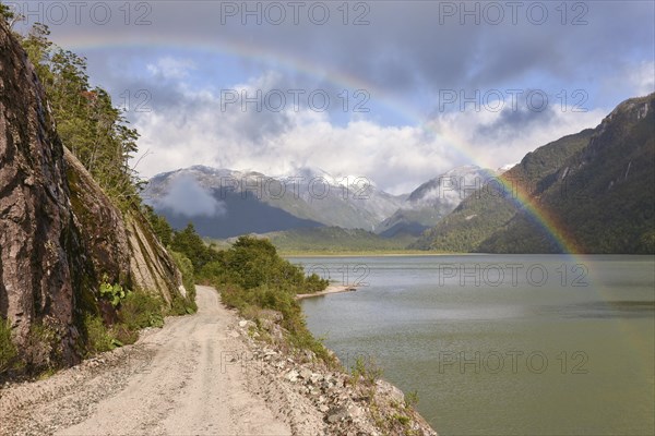 Gravel road with rainbow at Puerto Rio Tranquilo