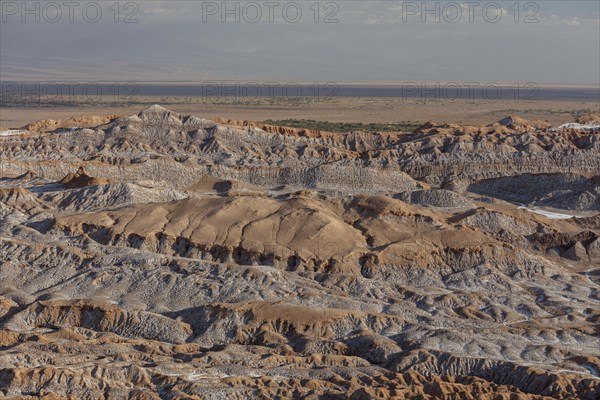 Bizarre red rock formations with white salt