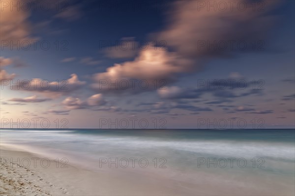 Afterglow with clouds by the sea