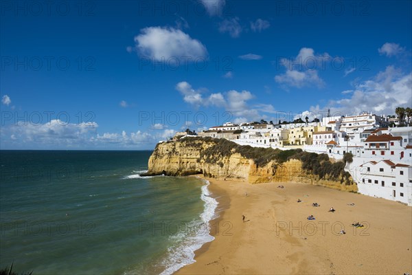 Bay with beach and colourful houses