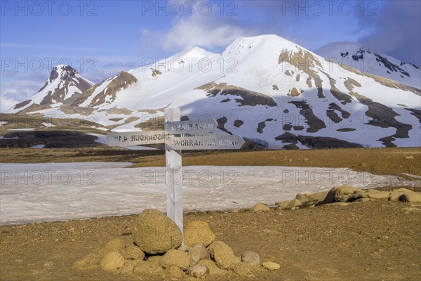 Signposts behind mountain Loomundur Fannborg and Snaekollur