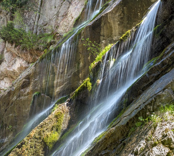 Waterfall on mossy slope