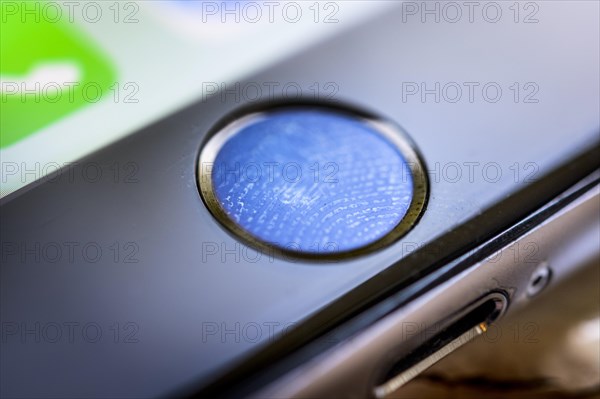 Close-up of Home button of the iPhone 6s with fingerprint on fingerprint sensor