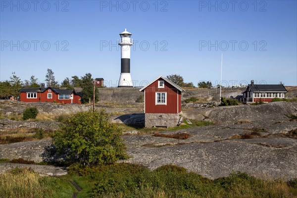 Red wooden houses with lighthouse