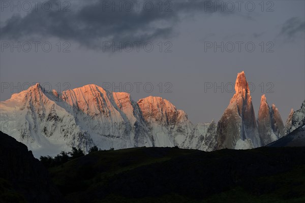 Snow-covered massif of Cerro Torre at sunrise