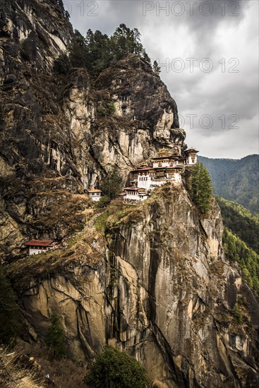 Buddhist tiger nest monastery Taktshang on steep rock face