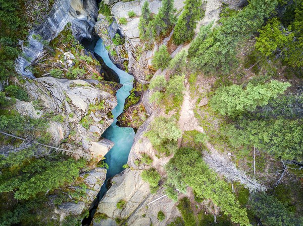 Mistaya Canyon with rich blue color water coming from icefields