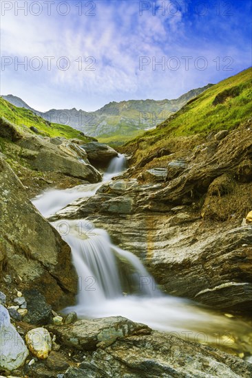 Mountain landscape with small waterfall