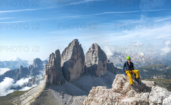 Hiker at the summit of the Paternkofel