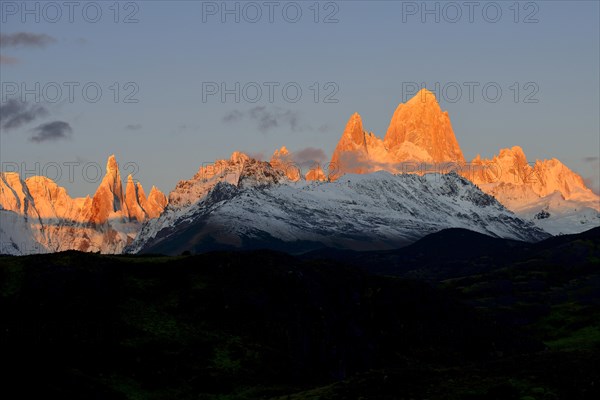 Snow-covered mountain range of the Fitz Roy and Cerro Torre at sunrise
