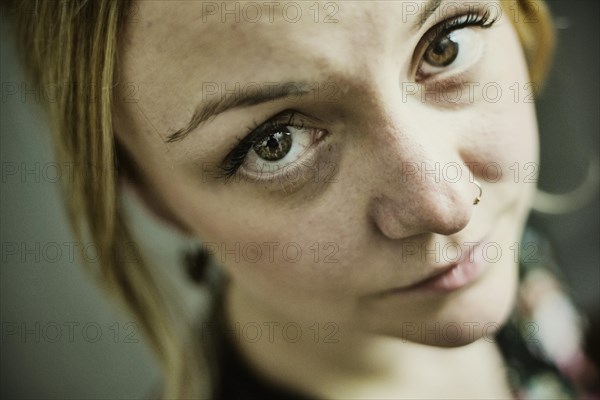 Young woman with nose piercing