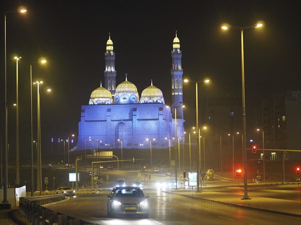 Traffic in front of illuminated Mohammed Al Ameen Mosque