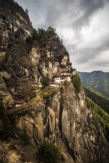 Buddhist tiger nest monastery Taktshang on steep rock face