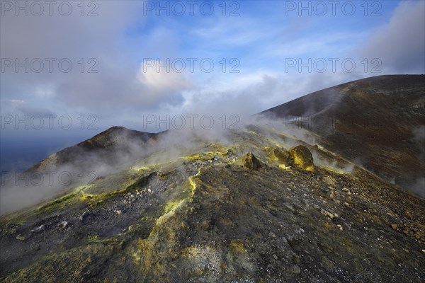 Sulfur fumaroles and chloride crusts on the crater rim