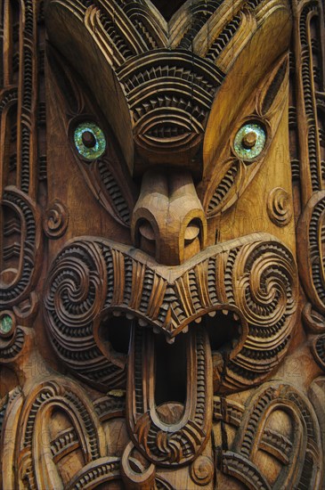 Traditional wood carved mask in the Te Puia Maori Cultural Center