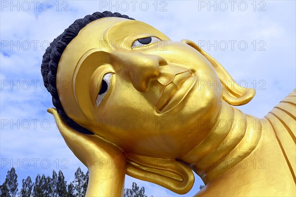 Lying golden Buddha in the temple Wat Sri Sunthon