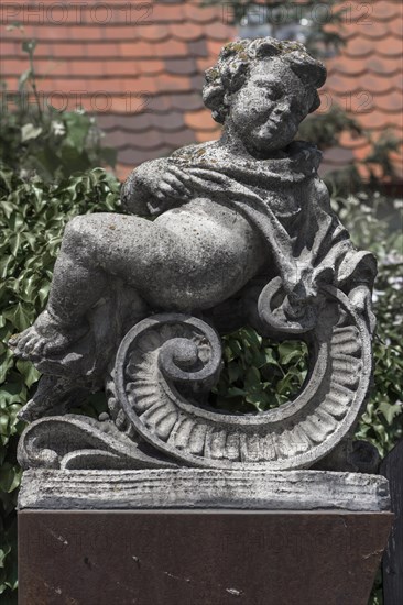 Putti figure on a wall