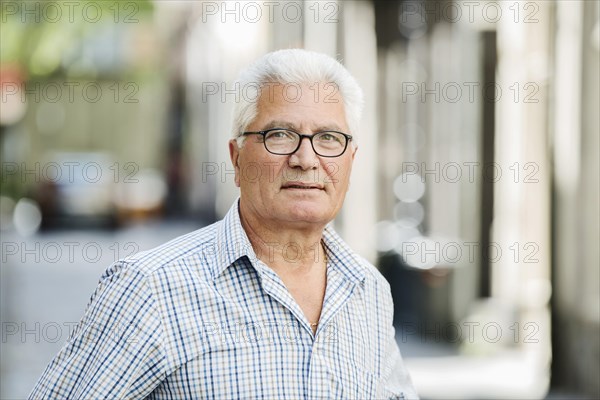 Grey-haired senior in the city