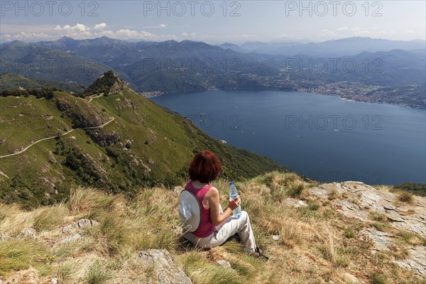 Hiker looks out from Morissolino to Lago Maggiore