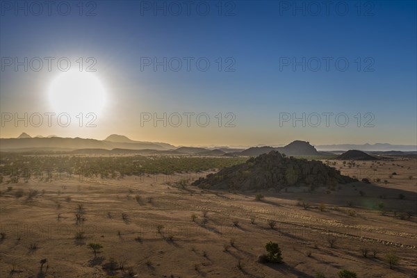 Atmospheric light in the evening over the mountainous landscape near Twyfelfontein
