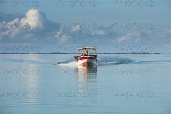 Boat in the waters of Tikehau