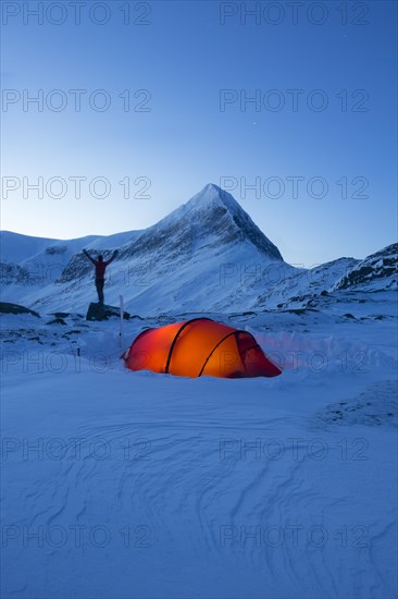Tent with person in the snow