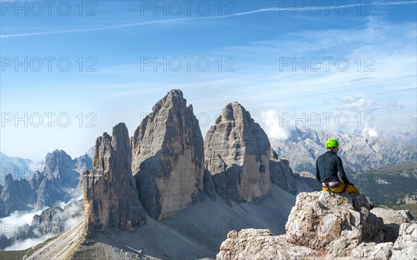 Hiker at the summit of the Paternkofel