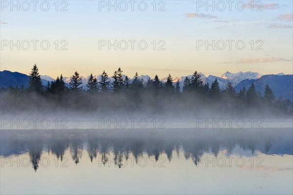Morning atmosphere with early morning mist at Kirchsee
