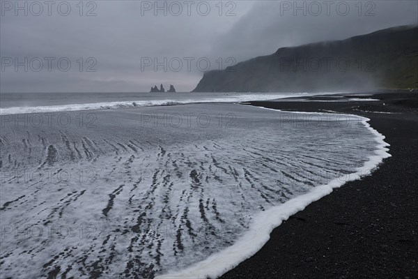 Expiring surf on the black beach near Vik i Myrdal